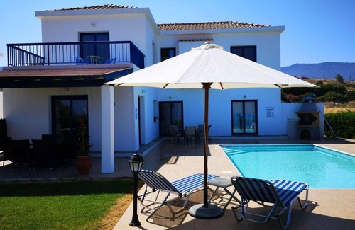 Pomos Villa | Beachfront 3 bed villa with sea views.