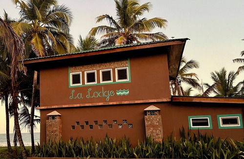 Corn Island House | 2 story home on beach, large breezy veranda for seamless indoor, outdoor living.