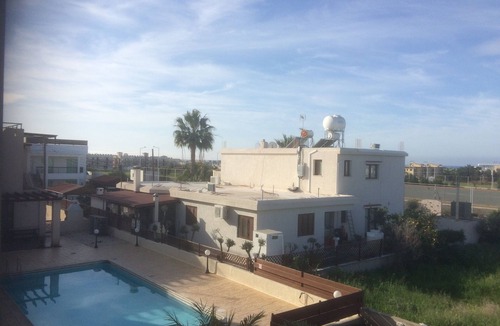 Paphos Apartment | Fabulous Roof Terrace near Tombs of the Kings on small complex with pool