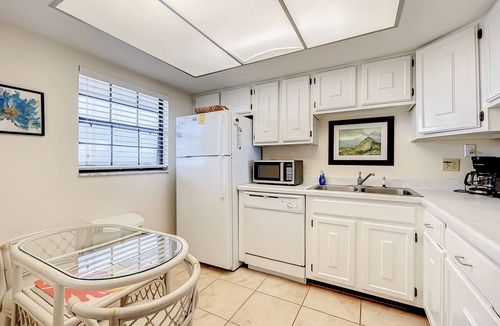 New Smyrna Beach Condo | Top Floor Corner Condo with Ocean View Balcony Heated Pool and Car Free Beach