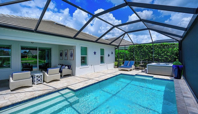 Indulge in a lavish home, heated saltwater pool, & spa, near all Naples offers. in Naples