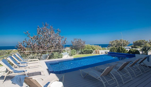 Picture Relaxing Beside Your Private Pool in Protaras Reading Your Favourite Book in Protaras