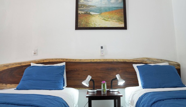Poolside Family Room with 2 twin beds in El Gigante