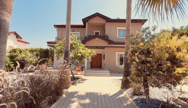 Spacious detached villa with a private swimming pool and landscaped garden in Alsancak
