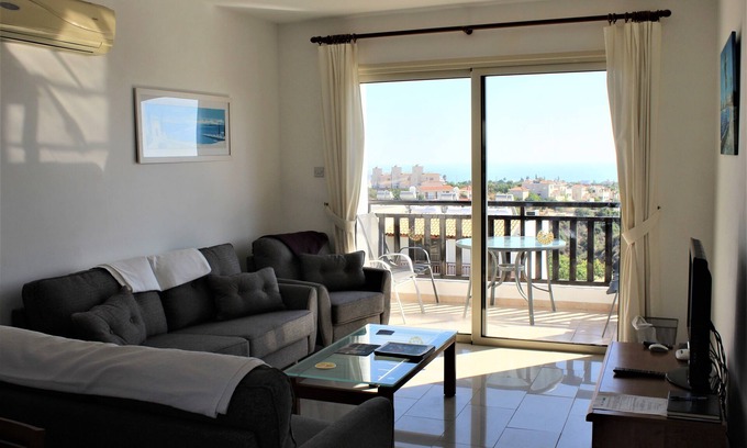 Peyia Town Apartment | 2 bed top floor apartment, stunning views, Aircon, 2 pools, Free unlimited WIFI