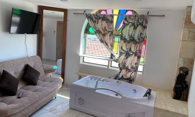 Agios Athanasios Apartment | Reina 1 Bedroom Apartment with Jacuzzi, Court Yard Seating Family & Pet Friendly