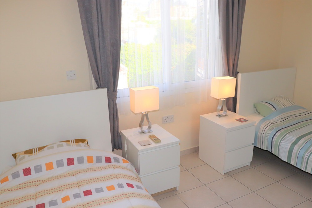 Peyia Town House | Direct access to the pool from the garden. A sandy beach is a few minutes away.