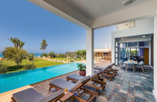 Pegeia Villa | Seafront Villa Kyma by Ezoria Villas
